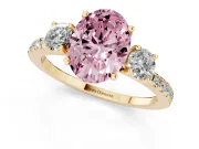 Fancy Pink Oval Cut Diamond Three-Stone Ring Set in Yellow gold with Pavé Band and Graduated Sides