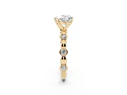 Heart Cut Diamond Solitaire Ring Set in Yellow gold with Bezel-Set Accents on Beaded Band and Prong Setting