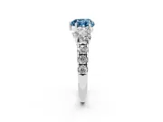 Fancy Blue Heart Cut Diamond Three-Stone Ring Set in Platinum with Pavé Band