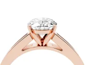 Oval Cut Diamond Solitaire Ring Set in Rose gold with Channel-Set Band and Prong Setting