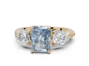 Radiant Cut Three Stone Engagement Ring Setting for a Fancy Blue Lab-Grown Diamond | Tapered Pave Band | Yellow Gold
