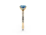 Fancy Blue Round Cut Diamond Brilliant Solitaire Ring Set in Yellow gold with Pavé Band and Prong Setting