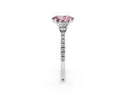 Fancy Pink Oval Cut Diamond Three-Stone Ring Set in Platinum with Pavé Band and Graduated Sides