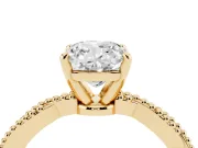 Cushion Cut Diamond Solitaire Ring Set in Yellow gold with Twisted Band and Bead Prong Setting
