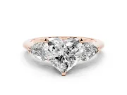Three-Stone Heart Cut Diamond Ring Set in Rose gold with Pear Side Stones and Prong Setting