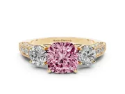 Fancy Pink Cushion Cut Diamond Three-Stone Ring Set in Yellow gold with Round Side Stones and Pavé Band