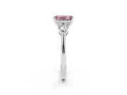 Fancy Pink Three-Stone Emerald Cut Diamond Ring Set in Platinum with Pear Side Stones and Prong Setting