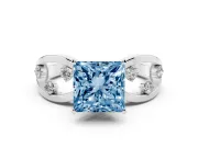 Fancy Blue Princess Cut Diamond Solitaire Ring Set in Silver with Side Stones on Criss-Cross Band and Prong Setting