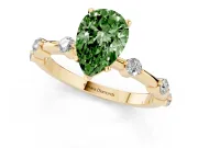 Fancy Green Pear Cut Diamond Solitaire Ring Set in Yellow gold with Bezel Set Side Stones and Prong Setting