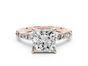 Princess Cut Diamond Solitaire Set in Rose gold with Side Baguettes and Channel Set Band