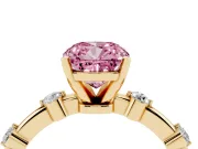 Fancy Pink Cushion Cut Diamond Solitaire Ring Set in Yellow gold with Bezel Set Side Stones and Prong Setting