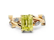 Fancy Yellow Emerald Cut Diamond Solitaire Ring Set in Yellow gold with Twisted Marquise Accent Band