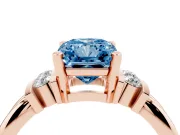 Fancy Blue Three-Stone Radiant Cut Diamond Channel Set Ring Set in Rose gold with Bar Prongs