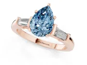 Fancy Blue Pear Cut Diamond Solitaire Ring Set in Rose gold with Tapered Baguette Accents and Prong Setting