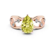 Fancy Yellow Pear Cut Diamond Solitaire Ring Set in Rose gold with Side Stones on Criss-Cross Band and Prong Setting