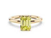 Fancy Yellow Emerald Cut Diamond Solitaire Ring Set in Yellow gold with Prong Setting on a Polished Plain Band