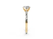 Round Cut Diamond Solitaire Set in Yellow gold with Side Baguettes and Channel Set Band