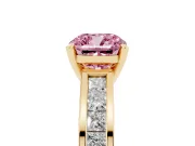 Fancy Pink Cushion Cut Diamond Solitaire Ring Set in Yellow gold with Channel-Set Band and Prong Setting