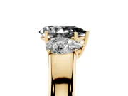 Fancy Black Three-Stone Pear Cut Diamond Ring Set in Yellow gold with Matching Prong Settings and Plain Band