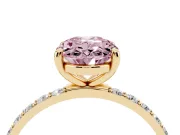 Fancy Pink Oval Cut Diamond Solitaire Ring Set in Yellow gold with Round Pavé Band and Prong Setting