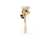 Pear Cut Diamond Solitaire Twist Engagement Ring Set in Yellow gold with Pavé Leaf Accents
