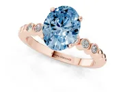 Fancy Blue Oval Cut Diamond Solitaire Engagement Ring Set in Rose gold with Bezel Accents on Beaded Band