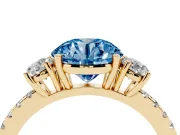 Fancy Blue Round Cut Diamond Three-Stone Ring Set in Yellow gold with Pavé Band and Graduated Sides