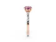 Fancy Pink Round Cut Diamond Solitaire Set in Rose gold with Side Baguettes and Channel Set Band