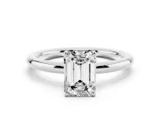Emerald Cut Diamond Solitaire Ring Set in Platinum with Prong Setting on a Polished Plain Band