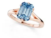 Fancy Blue Emerald Cut Diamond Solitaire Ring Set in Rose gold with Polished Tapered Band and Prong Setting
