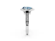 Fancy Blue Pear Cut Diamond Halo Solitaire Ring Set in Platinum with Pavé Band and Bezel Setting