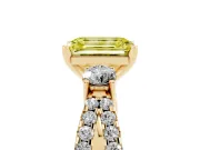Fancy Yellow Emerald Cut Diamond Three-Stone Ring Set in Yellow gold with Pavé Split Shank and Prong Setting