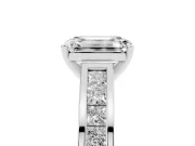 Emerald Cut Diamond Solitaire Ring Set in Platinum with Channel-Set Band and Prong Setting