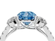 Fancy Blue Cushion Cut Diamond Three-Stone Ring Set in Platinum with Round Side Stones and Delicate Pavé Band