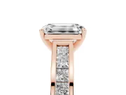 Emerald Cut Diamond Solitaire Ring Set in Rose gold with Channel-Set Band and Prong Setting