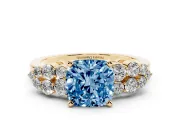 Fancy Blue Cushion Cut Diamond Cluster Engagement Ring Set in Yellow gold with Pavé Band and Prong Setting