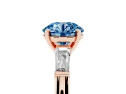 Fancy Blue Round Cut Diamond Solitaire Ring Set in Rose gold with Tapered Baguette Side Stones and Prong Setting