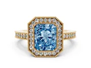 Fancy Blue Radiant Cut Diamond Halo Engagement Ring Set in Yellow gold with Pavé Band and Round Halo Stones