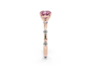 Fancy Pink Cushion Cut Diamond Solitaire Ring Set in Rose gold with Bezel Set Side Stones and Prong Setting