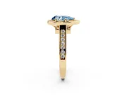 Fancy Blue Pear Cut Diamond Halo Solitaire Ring Set in Yellow gold with Pavé Band and Bezel Setting