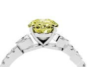 Fancy Yellow Oval Cut Diamond Solitaire Leaf-Inspired Ring Set in White gold with Pavé Band and Prong Setting