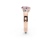Fancy Pink Three-Stone Pear Cut Diamond Ring Set in Rose gold with Matching Prong Settings and Plain Band