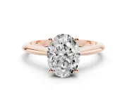 Oval Cut Diamond Solitaire Ring Set in Rose gold with Prong Setting on a Plain Round Band