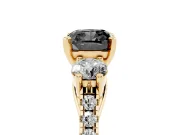Fancy Black Three-Stone Cushion Cut Diamond Pavé Band Ring Set in Yellow gold with Prong-Set Trio
