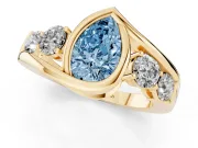 Fancy Blue Pear Cut Diamond Bezel Bypass Ring Set in Yellow gold with Round Accents