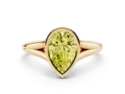 Fancy Yellow Bezel Set Pear Cut Diamond Solitaire Ring Set in Yellow gold with Tapered Band