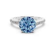 Fancy Blue Round Cut Diamond Solitaire Ring Set in Platinum with Pavé Accent Band and Classic Prong Setting