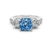 Fancy Blue Three-Stone Cushion Cut Diamond Pavé Band Ring Set in White gold with Prong-Set Trio
