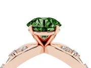 Fancy Green Round Cut Diamond Solitaire Ring Set in Rose gold with Side Stones on Criss-Cross Band and Prong Setting