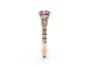 Fancy Pink Cushion Cut Diamond Three-Stone Ring Set in Yellow gold with Round Side Stones and Delicate Pavé Band